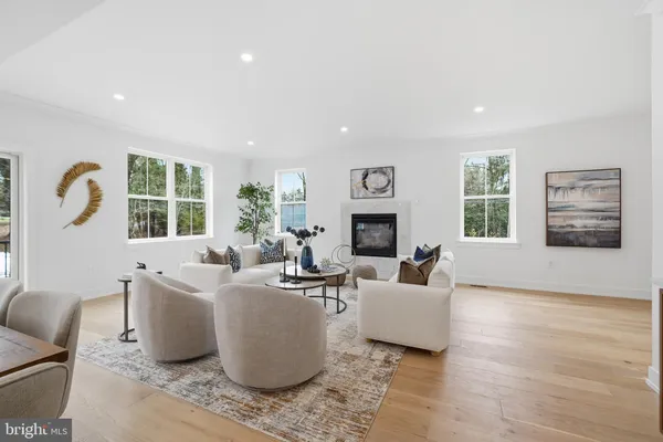 a living room with furniture a window and a fireplace
