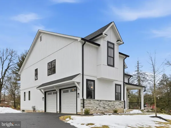 a front view of a house with garage
