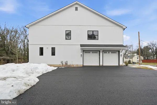 a view of a house with a snow in the yard