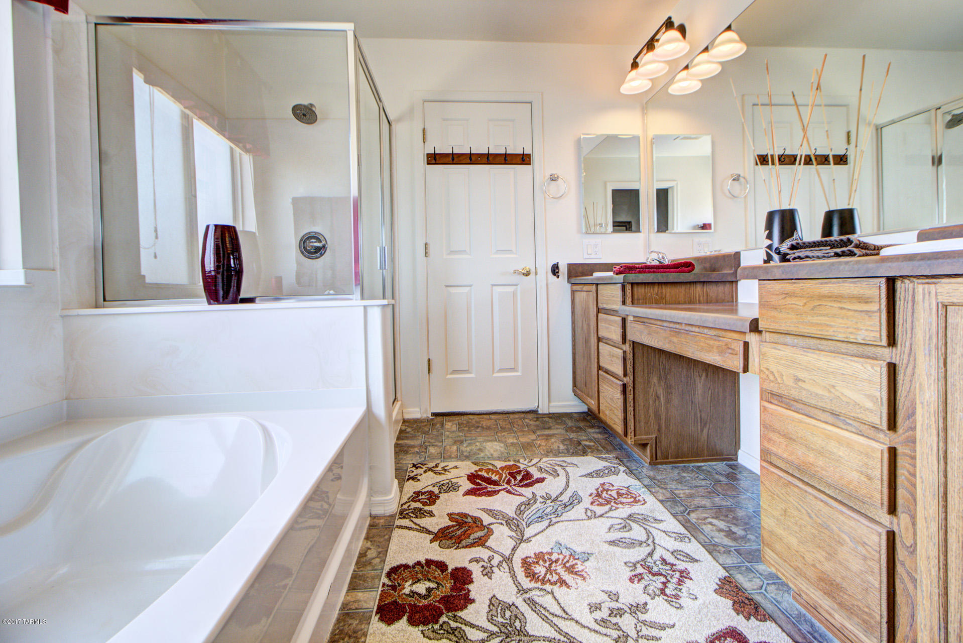 3588 East Mecate Road Tucson, AZ 85739 - Photo 24 of 36 a bathroom with a tub sink and mirror