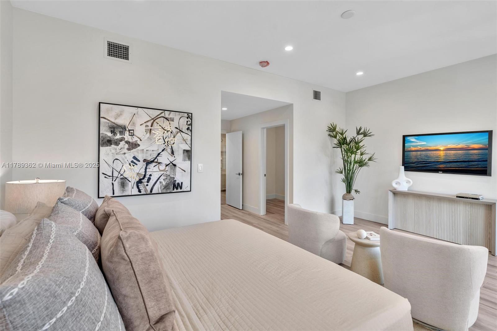 1389 Southwest 22nd Terrace Miami, FL 33145 - Photo 27 of 63 a bedroom with a large bed and a flat screen tv