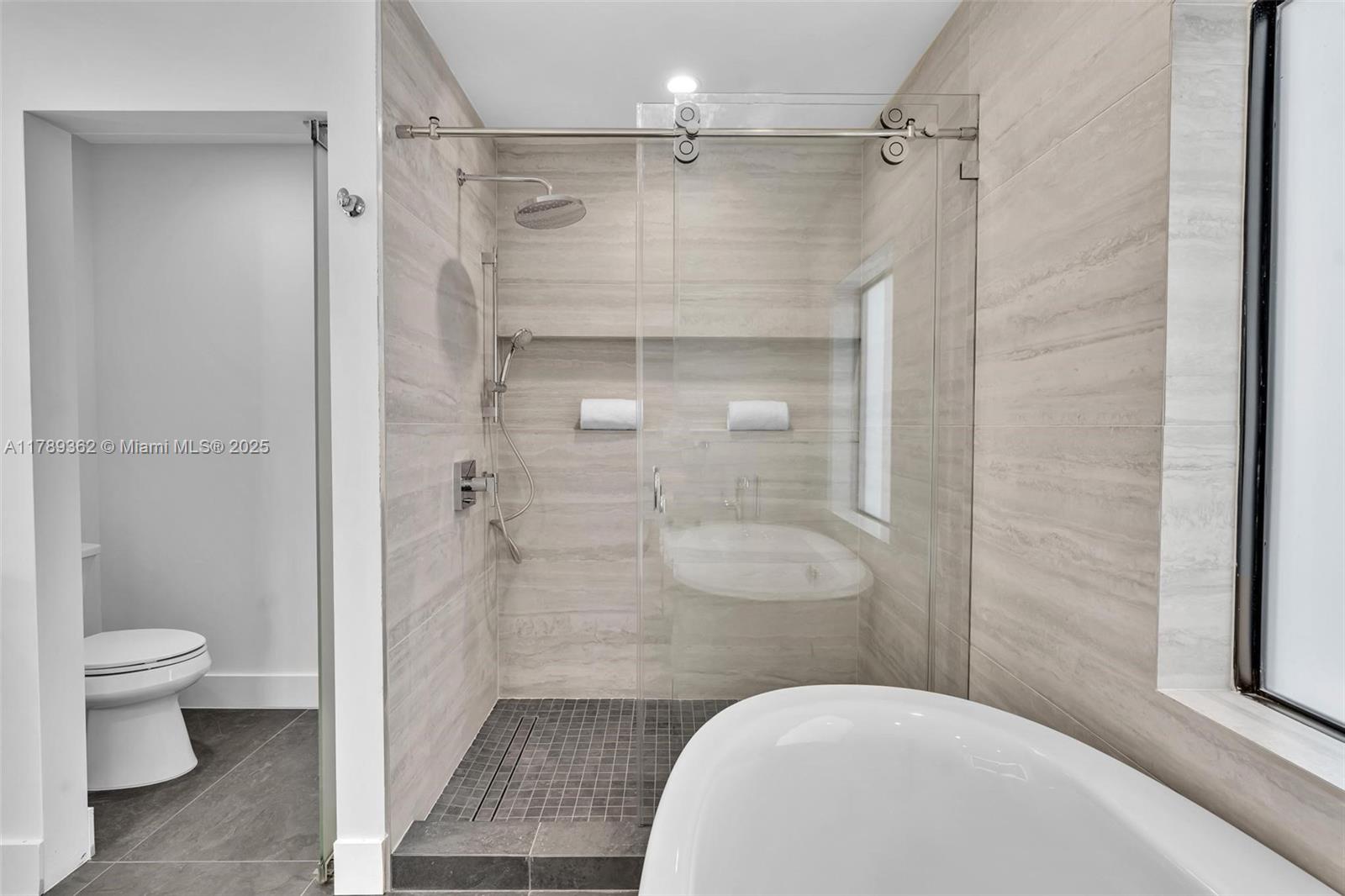 1389 Southwest 22nd Terrace Miami, FL 33145 - Photo 33 of 63 a bathroom with a shower and a toilet