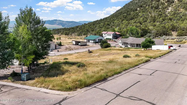 a swimming pool with outdoor seating and yard