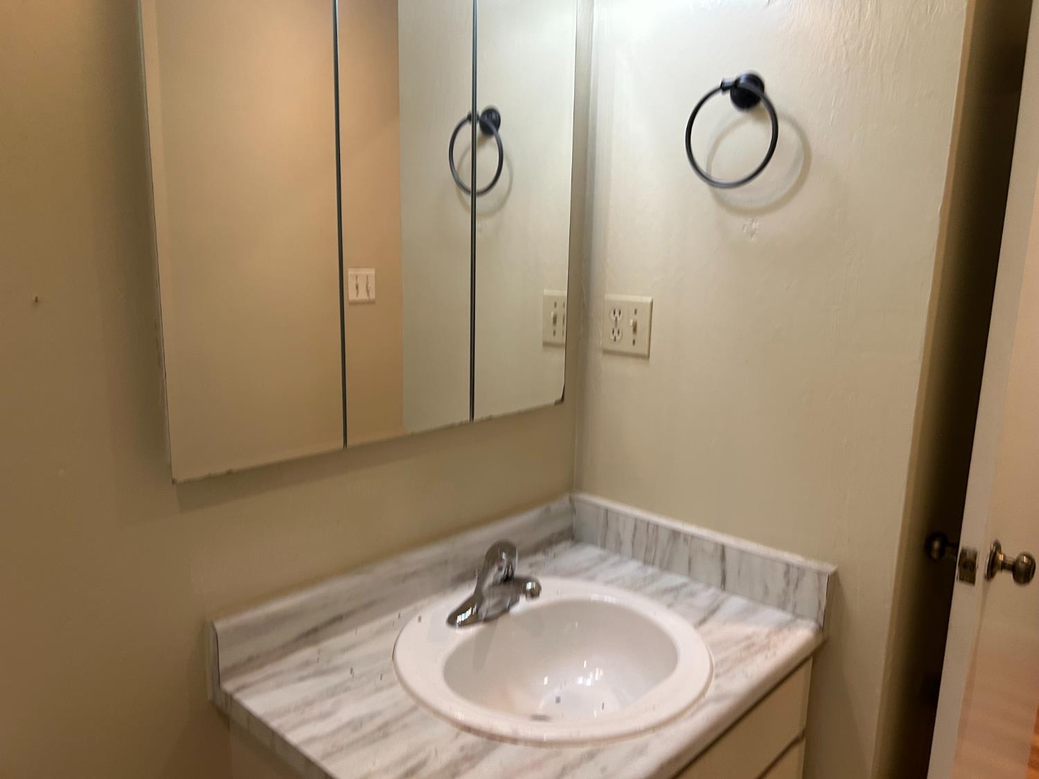 413 Shakeley Lane Ione, CA 95640 - Photo 7 of 11 a bathroom with a sink and a mirror