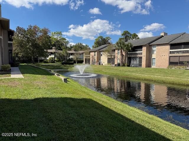 a front view of a house with a yard table and chairs