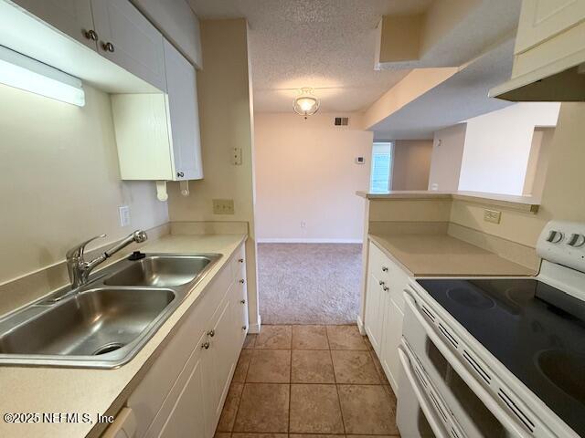 10200 Belle Rive Boulevard, Unit 69 Jacksonville, FL 32256 - Photo 13 of 27 a kitchen with a sink and a stove top oven