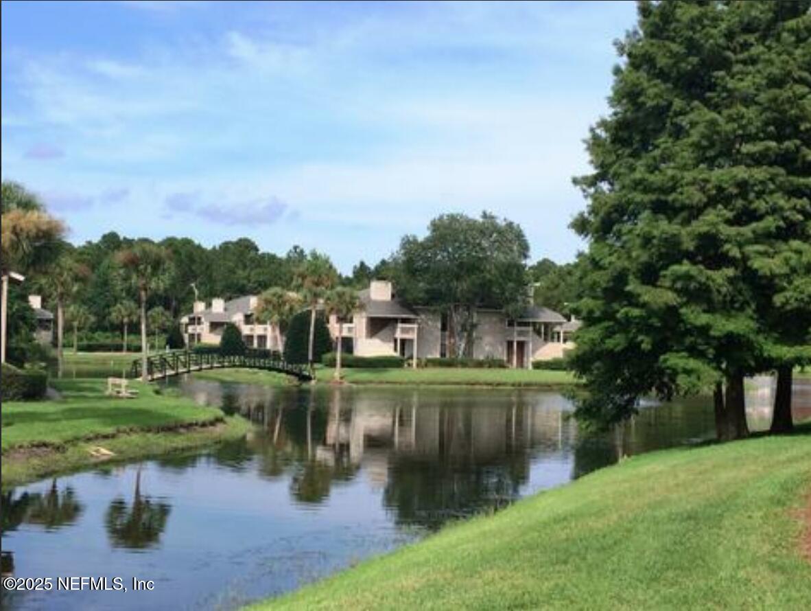 10200 Belle Rive Boulevard, Unit 69 Jacksonville, FL 32256 - Photo 2 of 27 an aerial view of a house with a yard