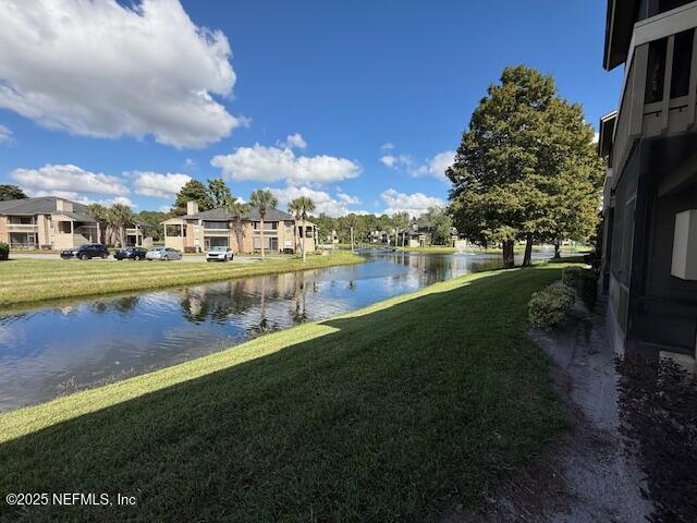 10200 Belle Rive Boulevard, Unit 69 Jacksonville, FL 32256 - Photo 5 of 27 a view of a city with tall buildings and a big yard