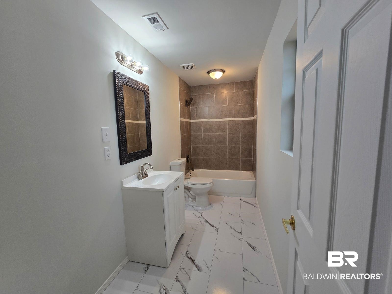 1600 Blair Road Brewton, AL 36426 - Photo 12 of 15 Full bathroom with vanity, toilet, and tiled shower / bath