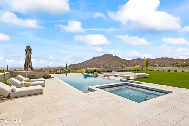 a view of swimming pool with a lounge chair
