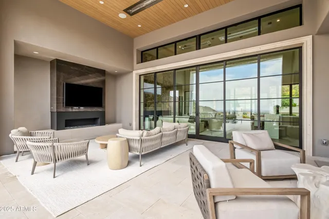 a view of swimming pool with outdoor seating and barbeque oven