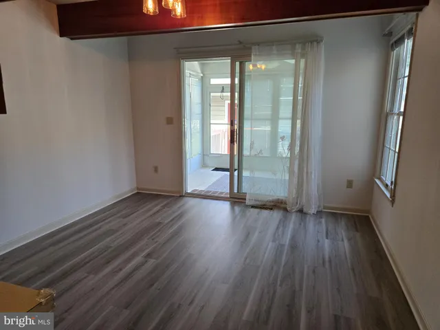 a view of wooden floor in an empty room