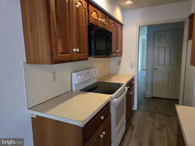 a kitchen with a stove and a microwave