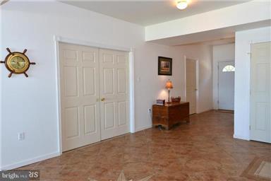entry foyer w/ loads of storage & elevator