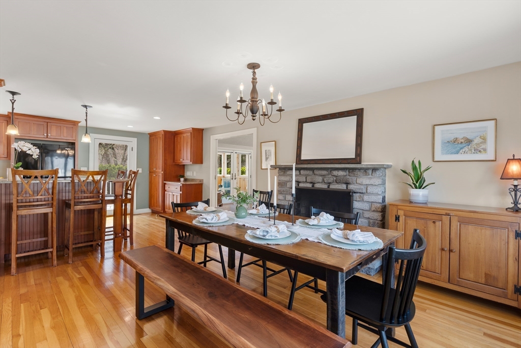 23 Alta Road Sudbury, MA 01776 - Photo 11 of 38 a dining room with furniture a chandelier and wooden floor