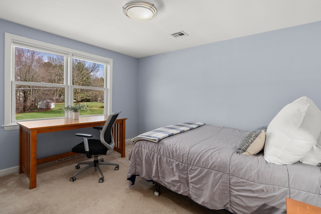 23 Alta Road Sudbury, MA 01776 - Photo 21 of 38 a bedroom with a bed and a desk