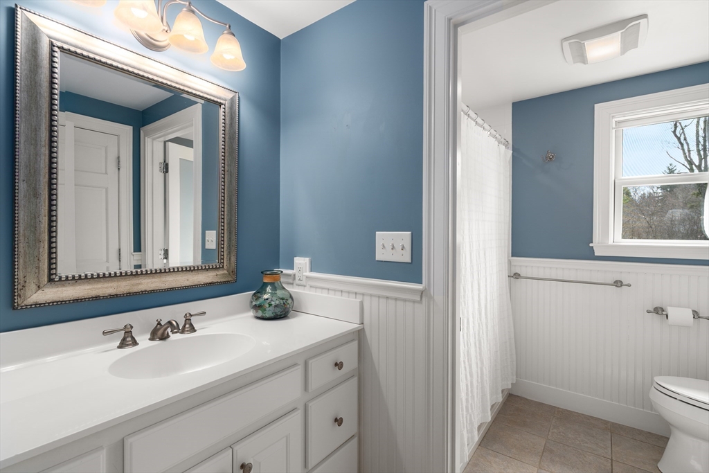 23 Alta Road Sudbury, MA 01776 - Photo 23 of 38 a bathroom with a sink and a toilet
