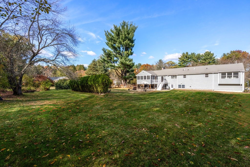 23 Alta Road Sudbury, MA 01776 - Photo 29 of 38 a view of house with yard and trees in the background