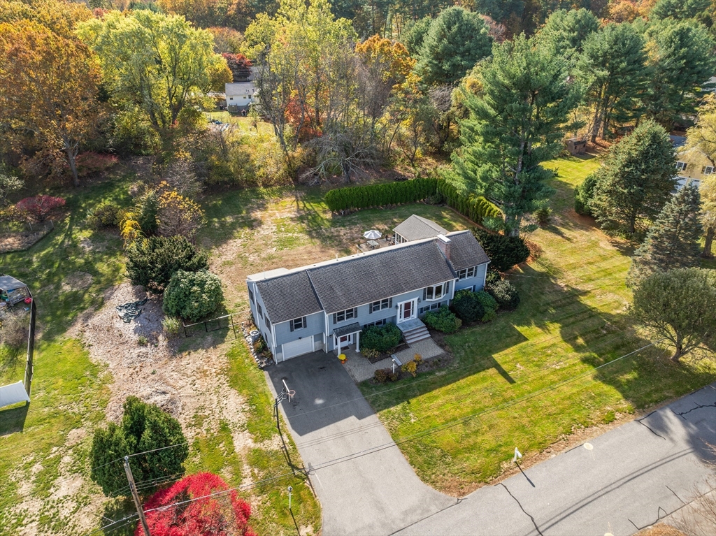 23 Alta Road Sudbury, MA 01776 - Photo 35 of 38 an aerial view of a house with swimming pool and large trees