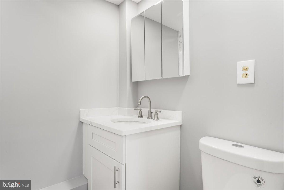 114 Cookstown New Egypt Road Wrightstown, NJ 08562 - Photo 12 of 30 a bathroom with a sink a toilet and a vanity