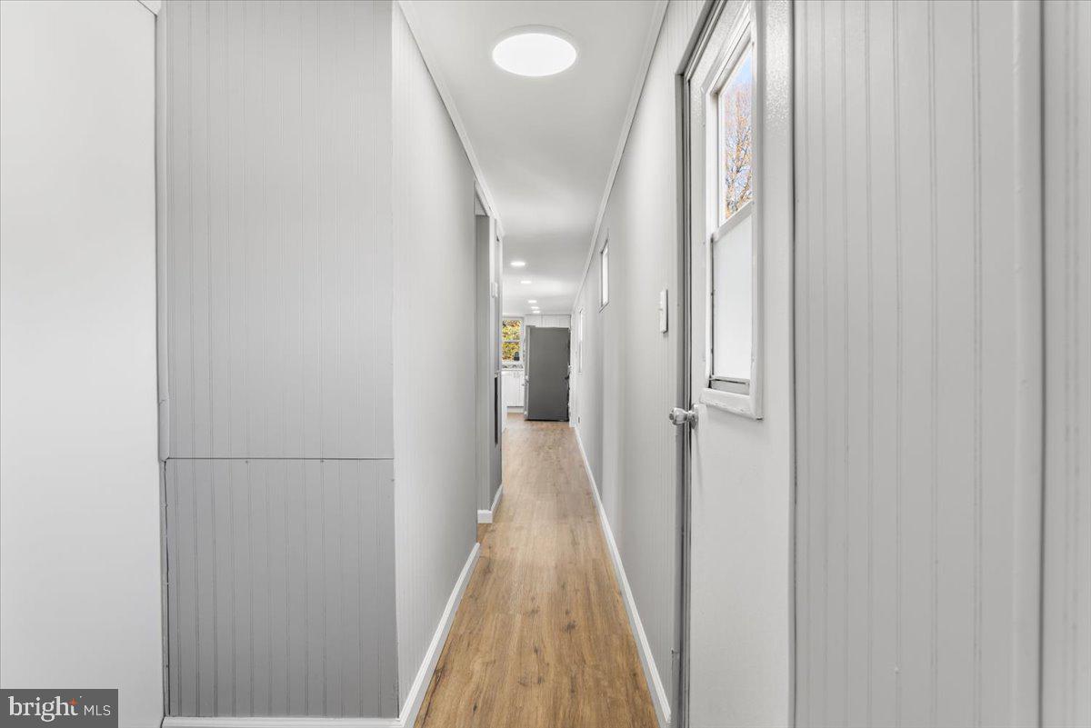 114 Cookstown New Egypt Road Wrightstown, NJ 08562 - Photo 15 of 30 a view of a hallway with wooden floor and glass doors