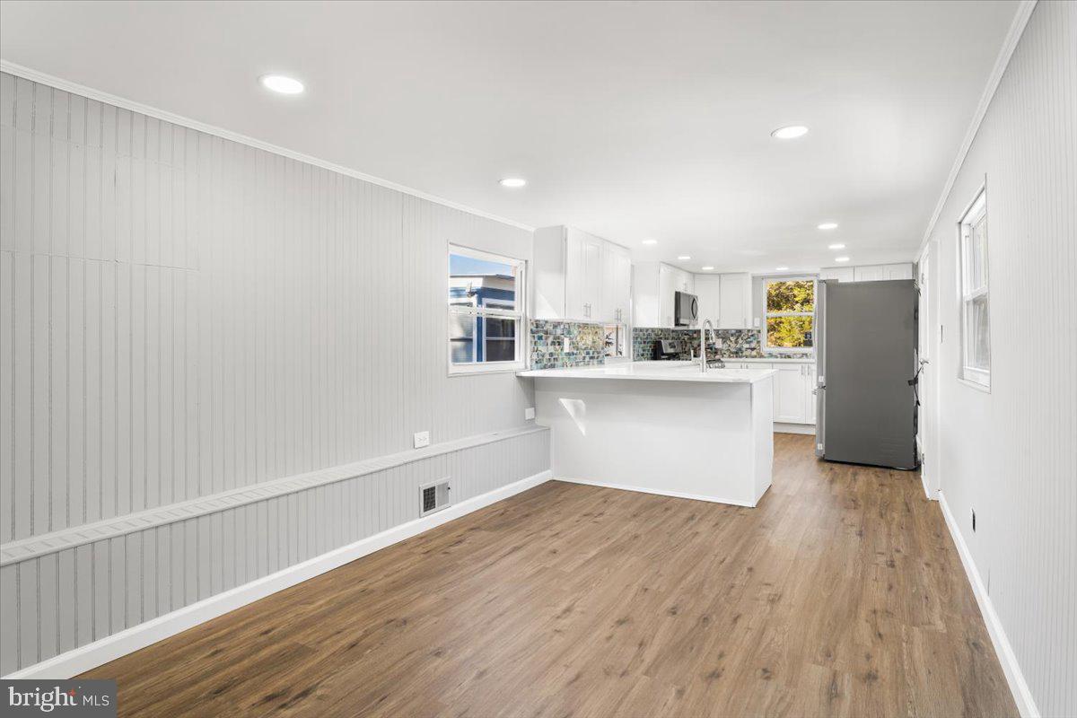 114 Cookstown New Egypt Road Wrightstown, NJ 08562 - Photo 18 of 30 a kitchen with stainless steel appliances a refrigerator sink and white cabinets