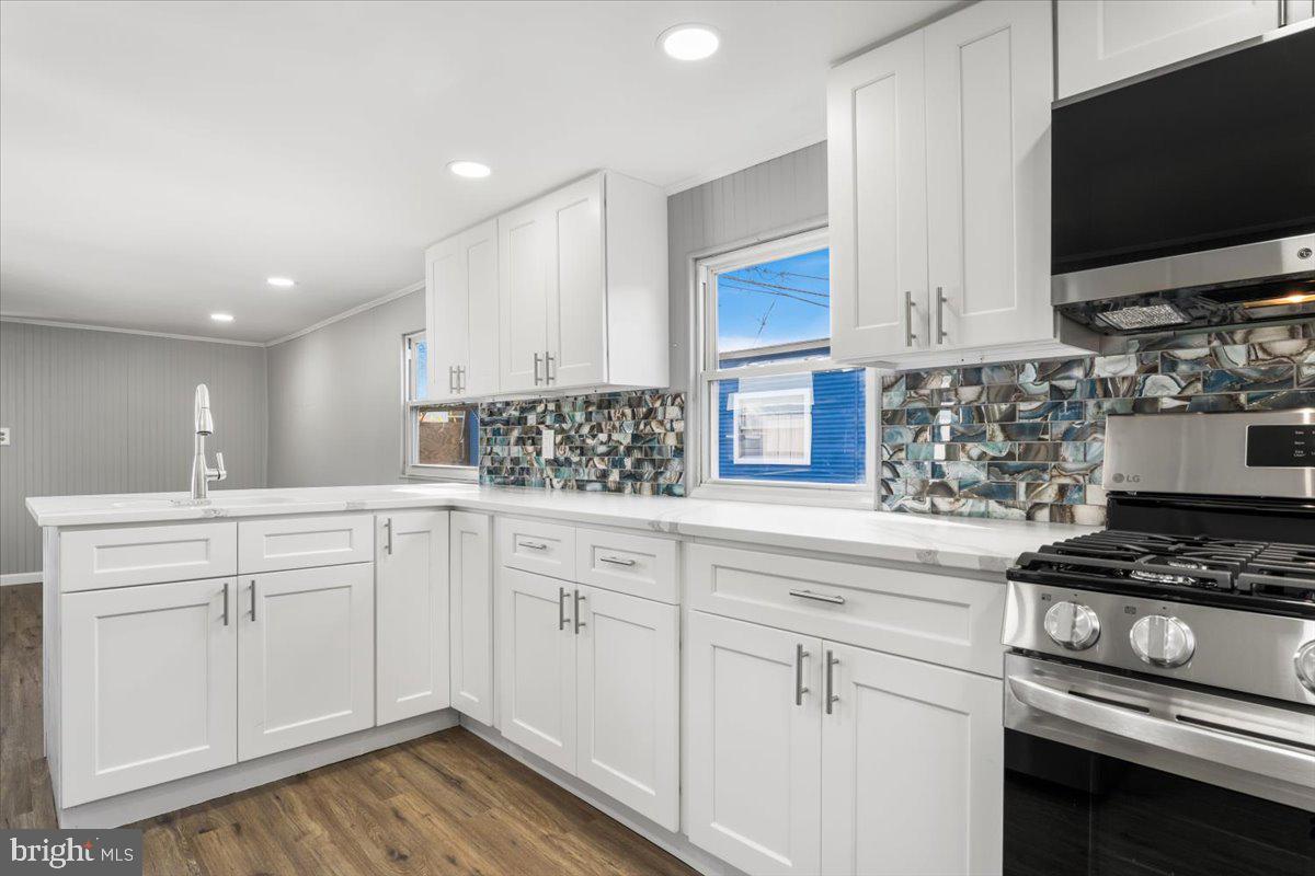 114 Cookstown New Egypt Road Wrightstown, NJ 08562 - Photo 23 of 30 a kitchen with white cabinets and appliances