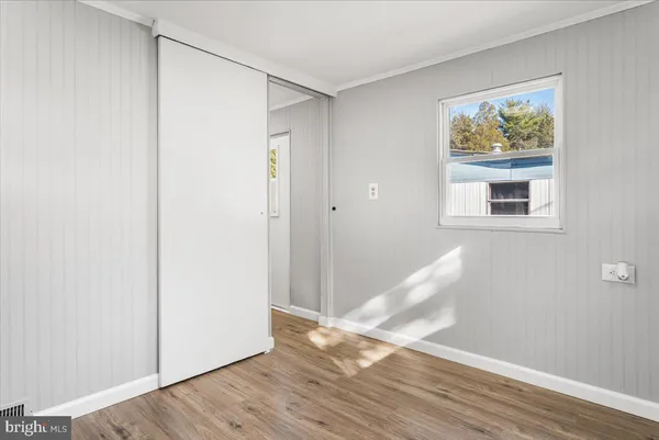a view of livingroom with hardwood floor and hallway