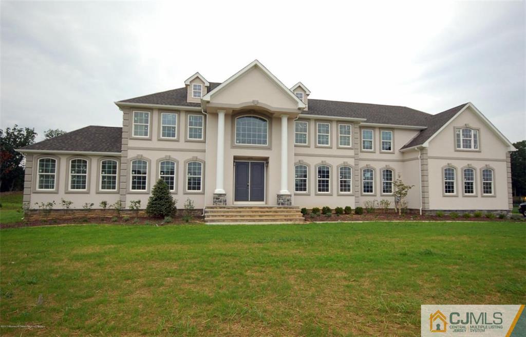 4 Beacon Hill Millstone Township, NJ 08510 - Photo 2 of 19 a front view of a house with a yard