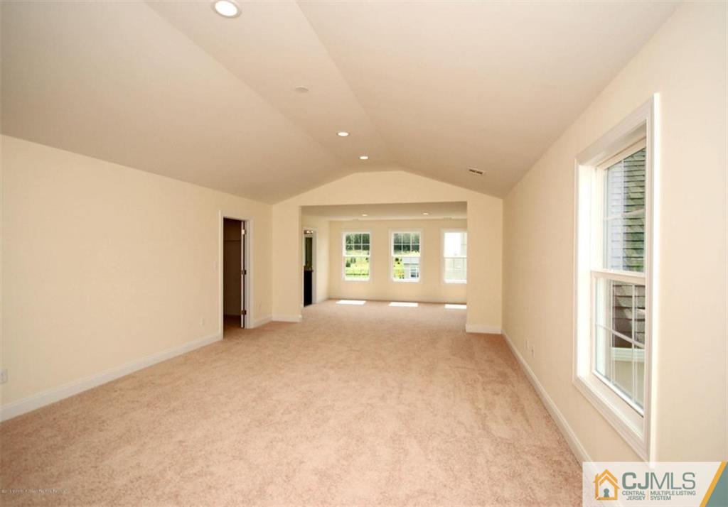 4 Beacon Hill Millstone Township, NJ 08510 - Photo 17 of 19 an empty room with windows and entrance