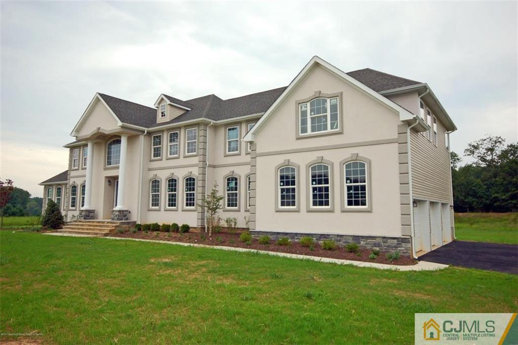 4 Beacon Hill Millstone Township, NJ 08510 - Photo 3 of 19 a front view of a house with a yard