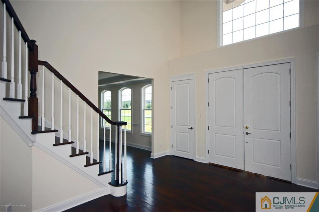 4 Beacon Hill Millstone Township, NJ 08510 - Photo 5 of 19 a view of entryway with wooden floor and stairs