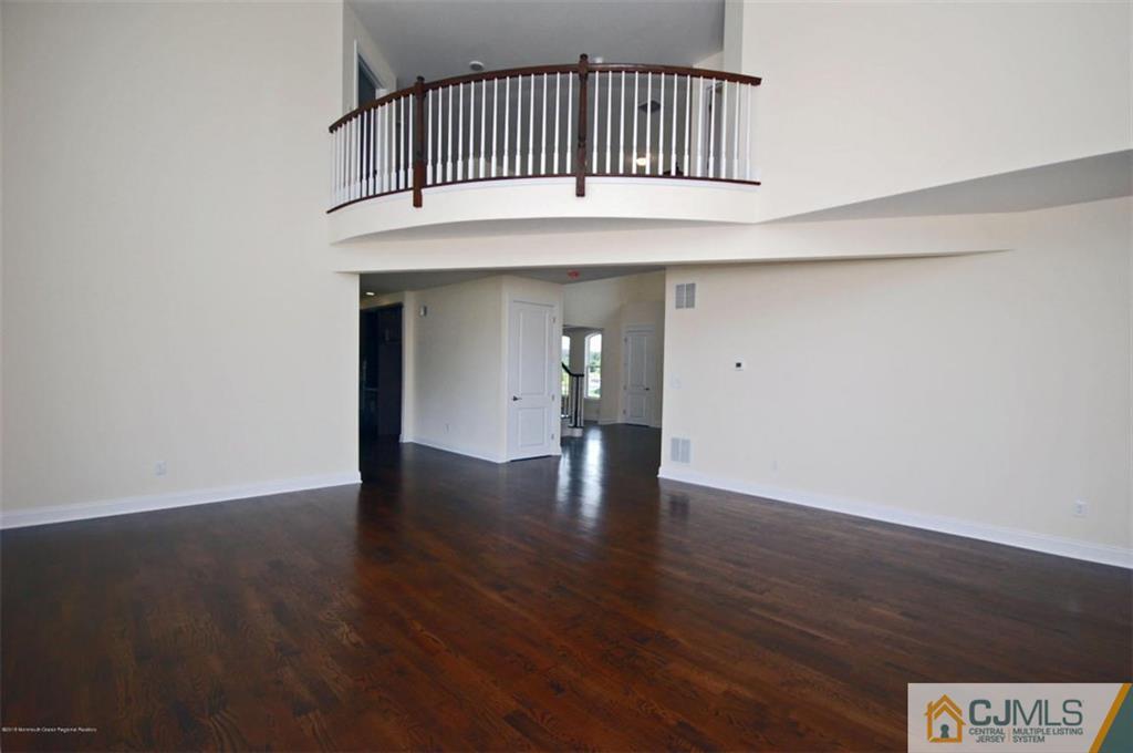 4 Beacon Hill Millstone Township, NJ 08510 - Photo 10 of 19 a view of a hallway with wooden floor