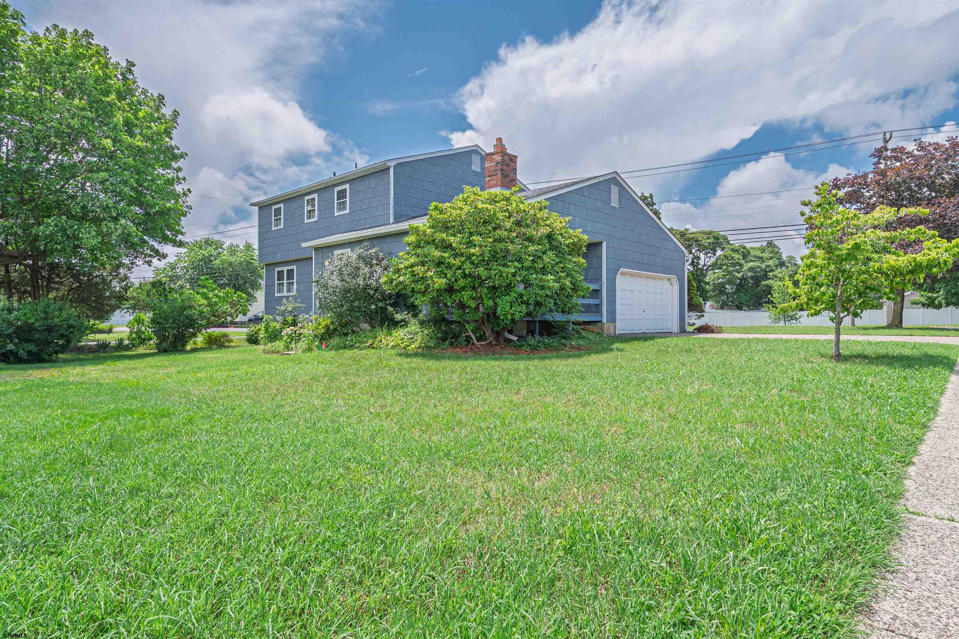 a view of a building with a yard