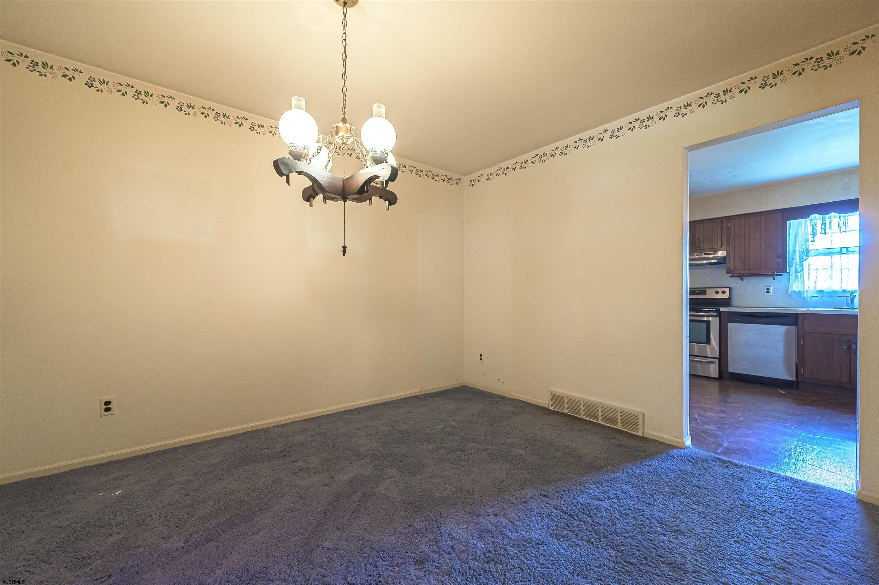 125 North Shore Road Marmora, NJ 08223 - Photo 11 of 29 a view of a room with a chandelier