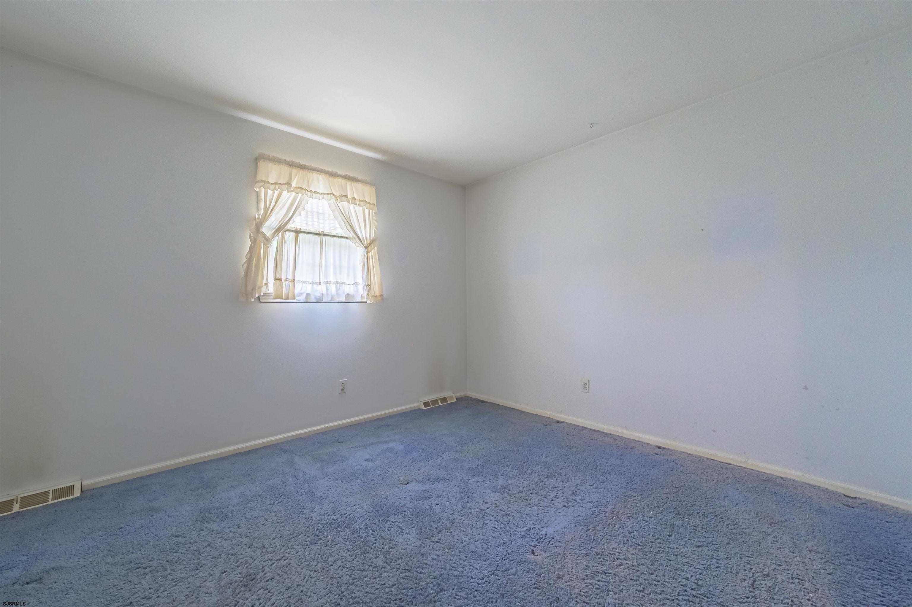 125 North Shore Road Marmora, NJ 08223 - Photo 21 of 29 an empty room with windows
