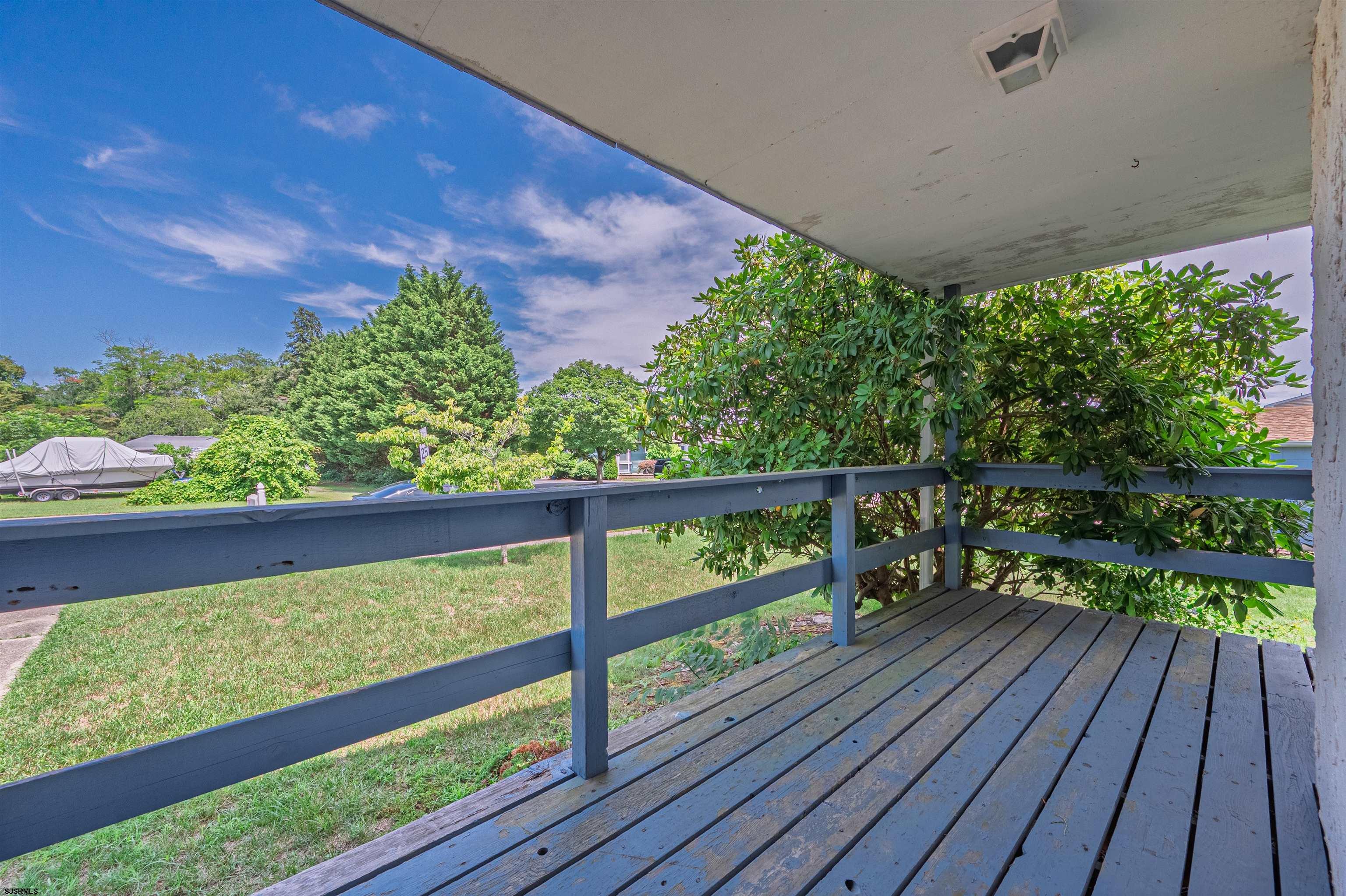 125 North Shore Road Marmora, NJ 08223 - Photo 5 of 29 a view of two chairs in a deck
