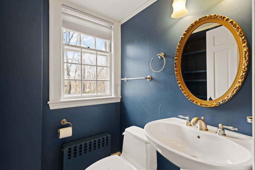 11 Eliot Road Lexington, MA 02421 - Photo 18 of 36 a bathroom with a sink and a mirror