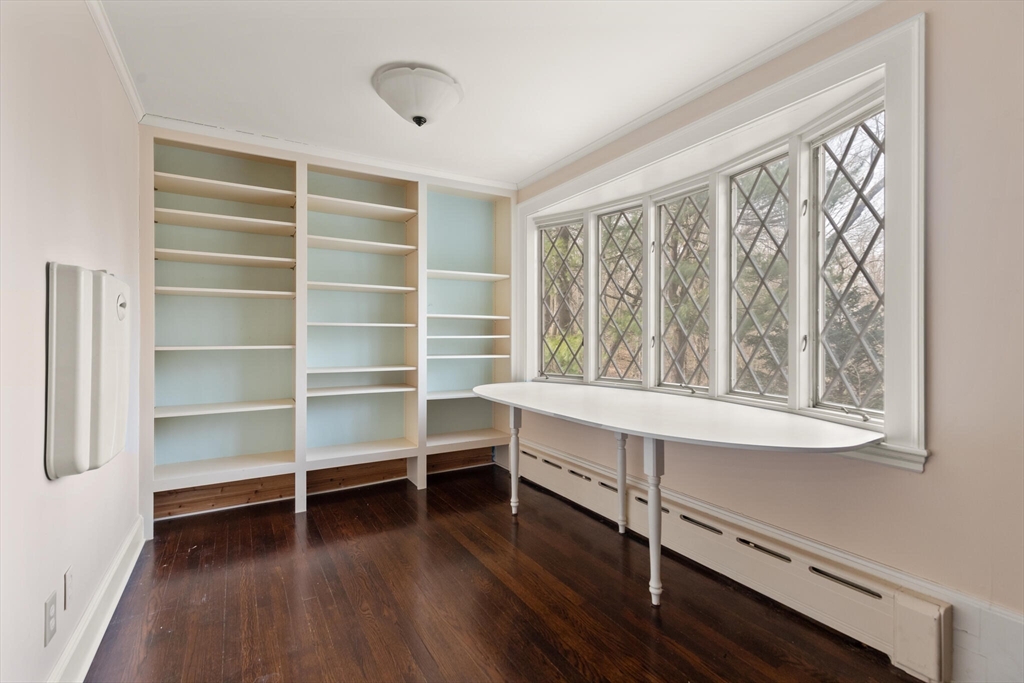 11 Eliot Road Lexington, MA 02421 - Photo 19 of 36 a view of an empty room with a window and wooden floor