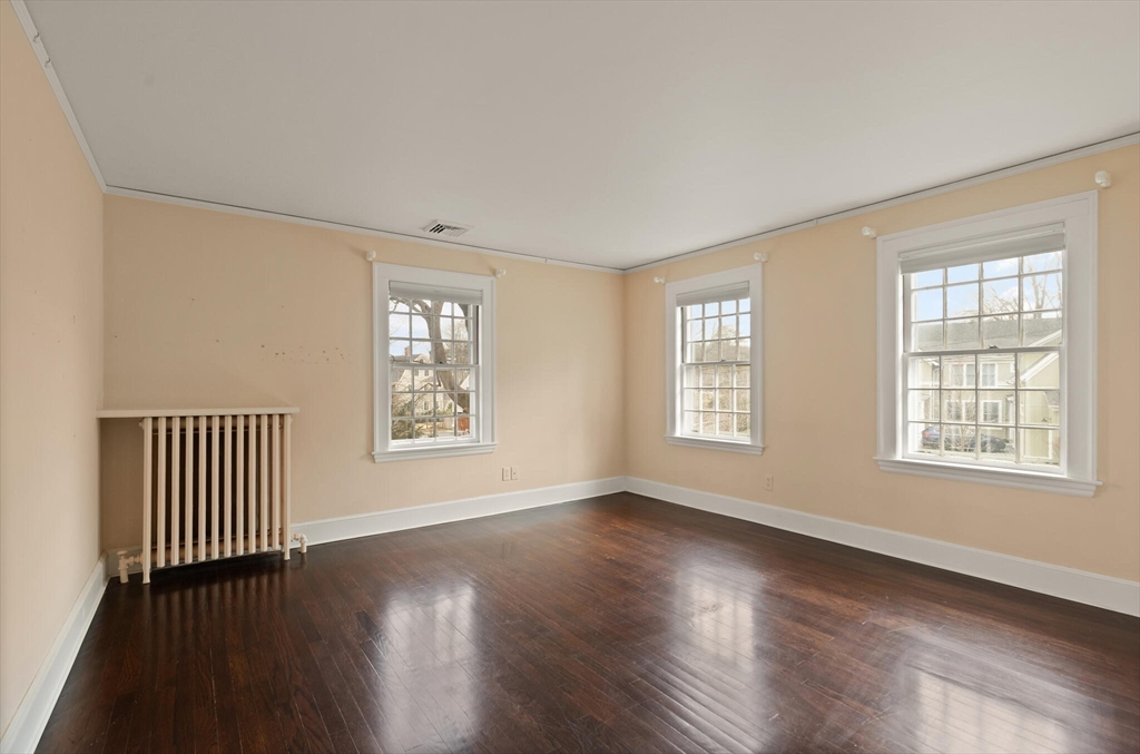 11 Eliot Road Lexington, MA 02421 - Photo 26 of 36 a view of an empty room with wooden floor and a window