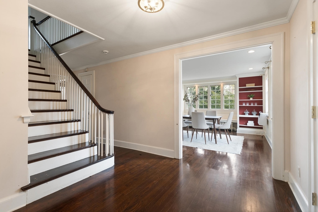 11 Eliot Road Lexington, MA 02421 - Photo 3 of 36 a view of dining room with hardwood floor and stairs
