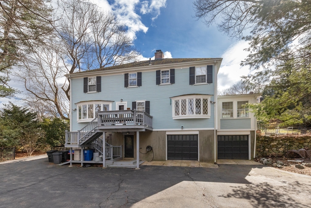 11 Eliot Road Lexington, MA 02421 - Photo 34 of 36 a front view of a house with a garage
