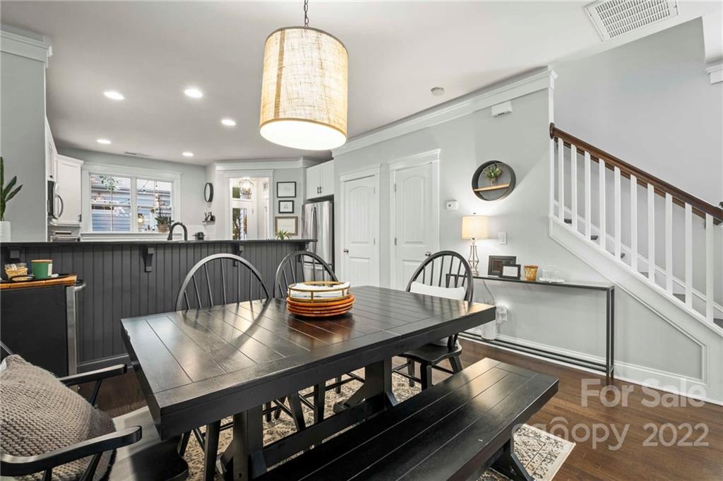 489 Jetton Street Davidson, NC 28036 - Photo 11 of 33 a kitchen with a table chairs and a dining table view