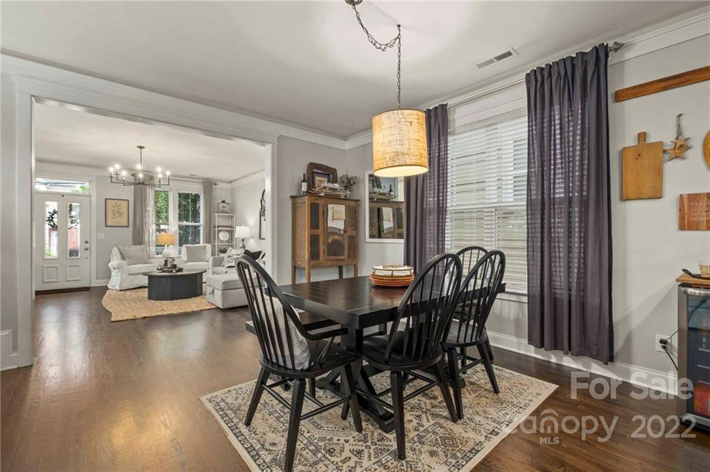 489 Jetton Street Davidson, NC 28036 - Photo 12 of 33 a view of a dining room with furniture window and wooden floor