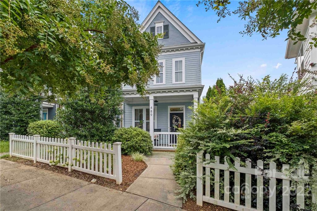 489 Jetton Street Davidson, NC 28036 - Photo 2 of 33 a front view of a house with trees