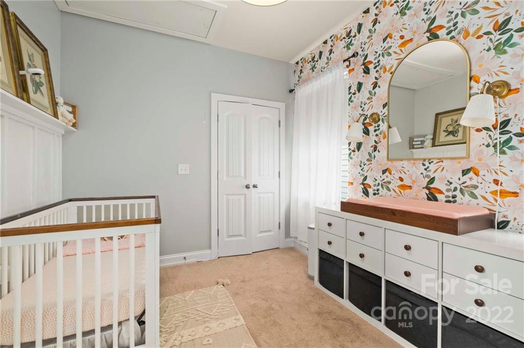 489 Jetton Street Davidson, NC 28036 - Photo 21 of 33 a bathroom with a sink and a mirror