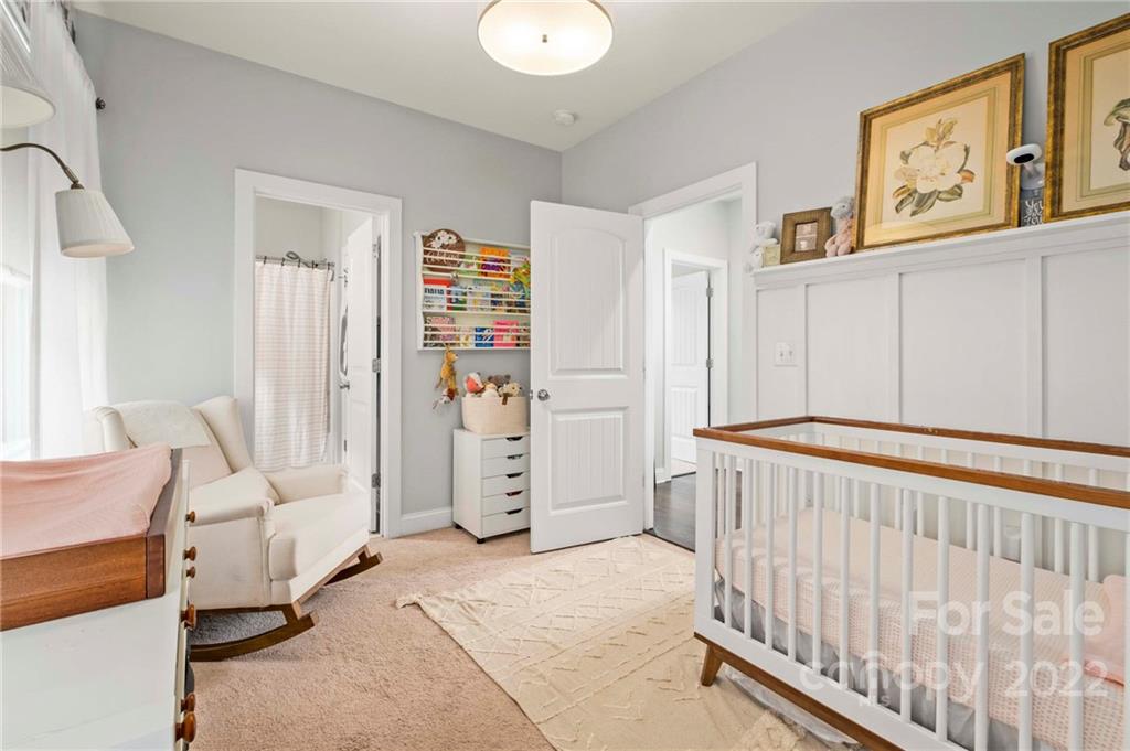 489 Jetton Street Davidson, NC 28036 - Photo 22 of 33 a bedroom with furniture and baby crib