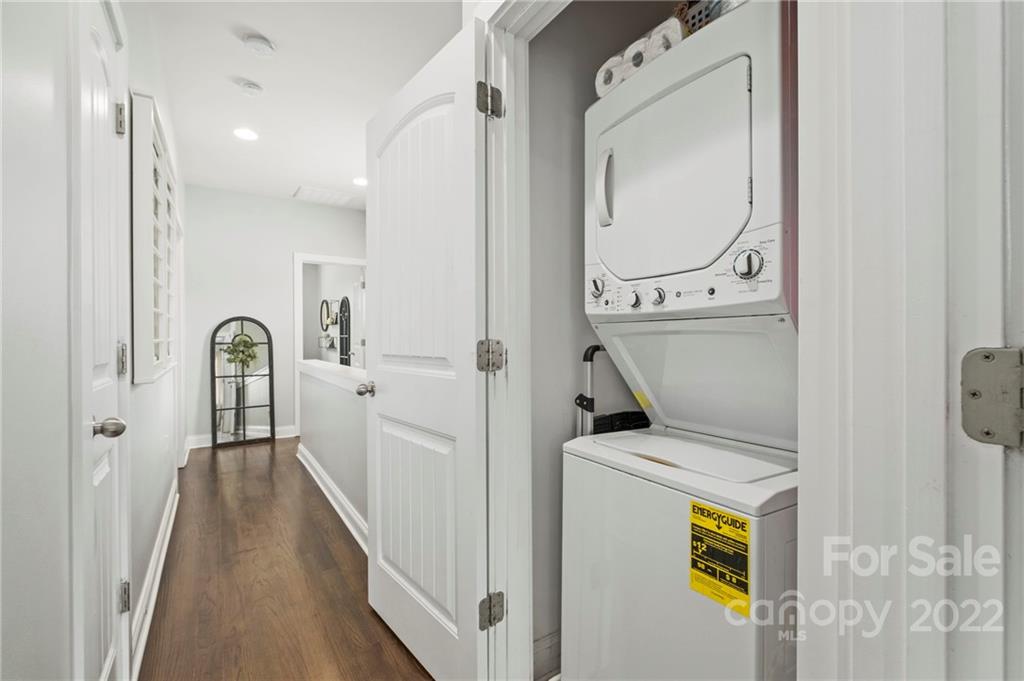 489 Jetton Street Davidson, NC 28036 - Photo 24 of 33 a view of a hallway with wooden floor and entryway