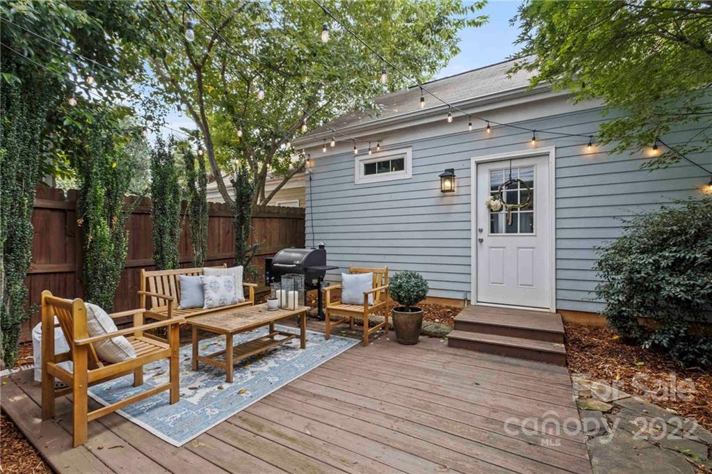 489 Jetton Street Davidson, NC 28036 - Photo 29 of 33 a backyard of a house with wooden floor and outdoor seating