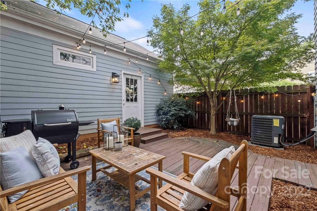 489 Jetton Street Davidson, NC 28036 - Photo 30 of 33 a view of a patio with a table and chairs